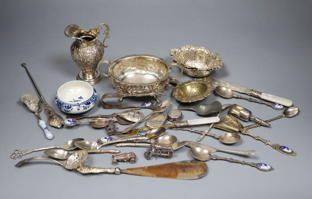A silver sugar bowl and cream jug, a pair of nut dishes and sundry small silver